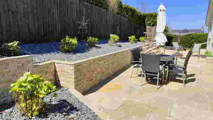 Limestone patio with Golden Quartz wall cladding Landscaping garden design Devon Plymstock Landscaping Company